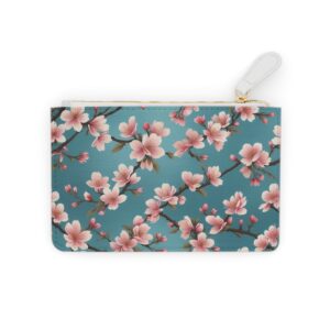 Elegant cherry blossoms drifting over a silk brocade pattern on a Mini Clutch Bag.