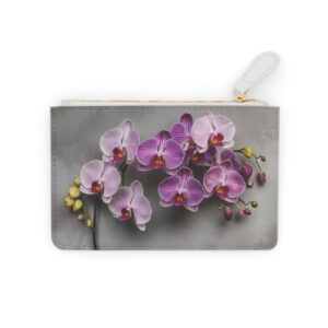 Mini clutch bag with orchids cascading against soft velvet textures