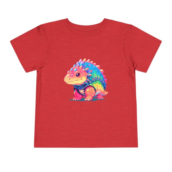 Toddler short sleeve tee with a smiling Ankylosaurus design on a blue background