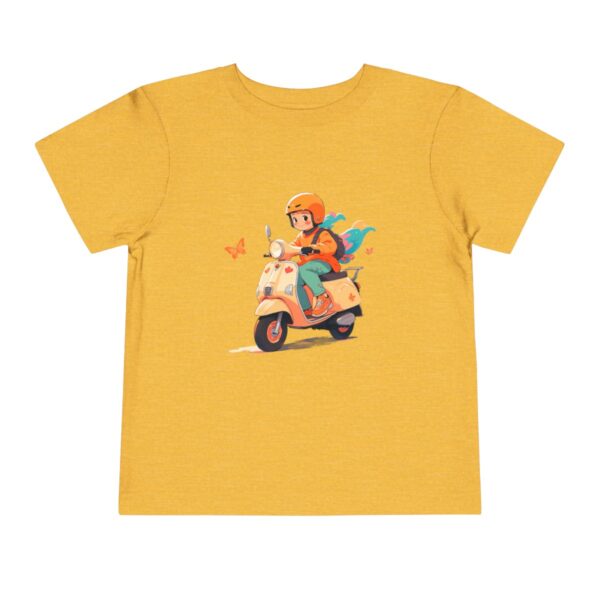 Toddler Short Sleeve Tee with a smiling rider on a scooter and colorful scarf design