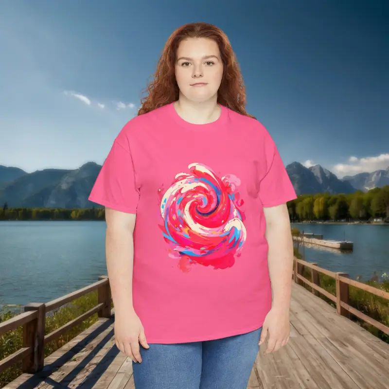 Bold Abstract Swirl Tee - Outdoor Style Curvy woman in a pink t-shirt with colorful abstract swirl design standing near a lake and mountains