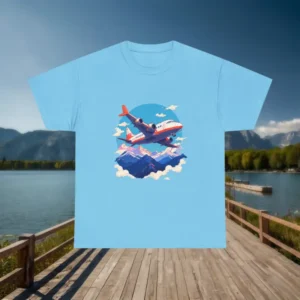 Blue t-shirt with airplane and mountain design displayed outdoors