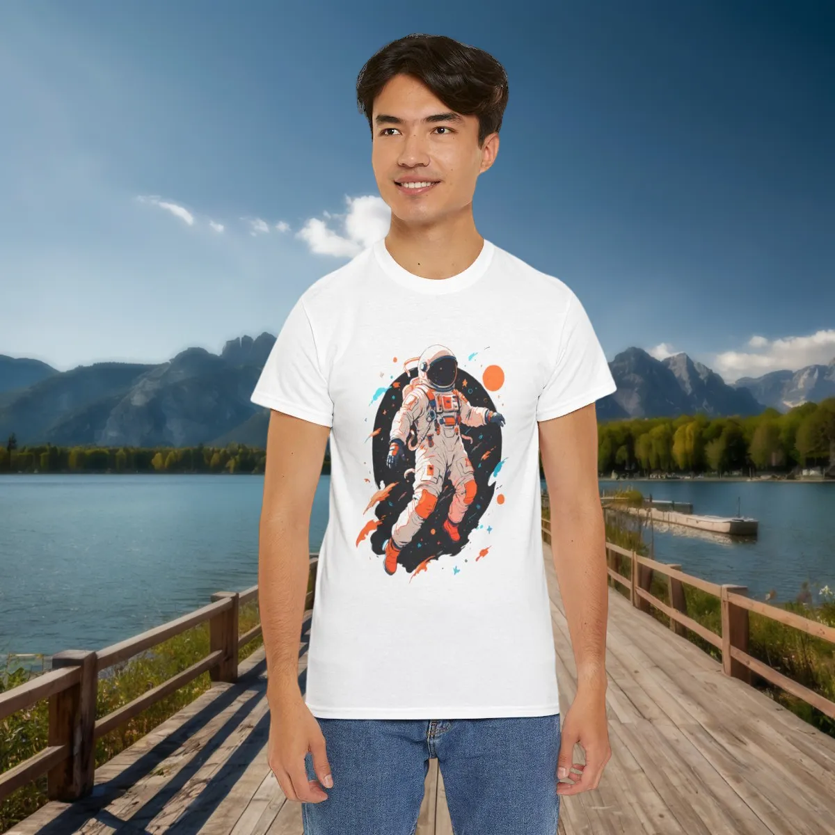 White T-Shirt Featuring Floating Astronaut in Galaxy Man wearing white t-shirt with colorful astronaut illustration