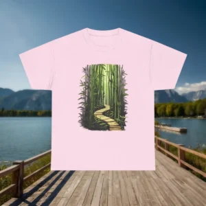 Pink t-shirt with a bamboo forest path illustration displayed against a lake and mountain backdrop.