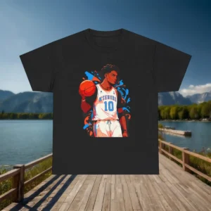 Black t-shirt with a dynamic basketball player illustration, displayed on a lakeside wooden dock with mountain scenery.