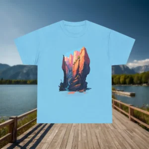 Flat lay of a light blue t-shirt with a bold canyon illustration featuring tall rocks and shadows.