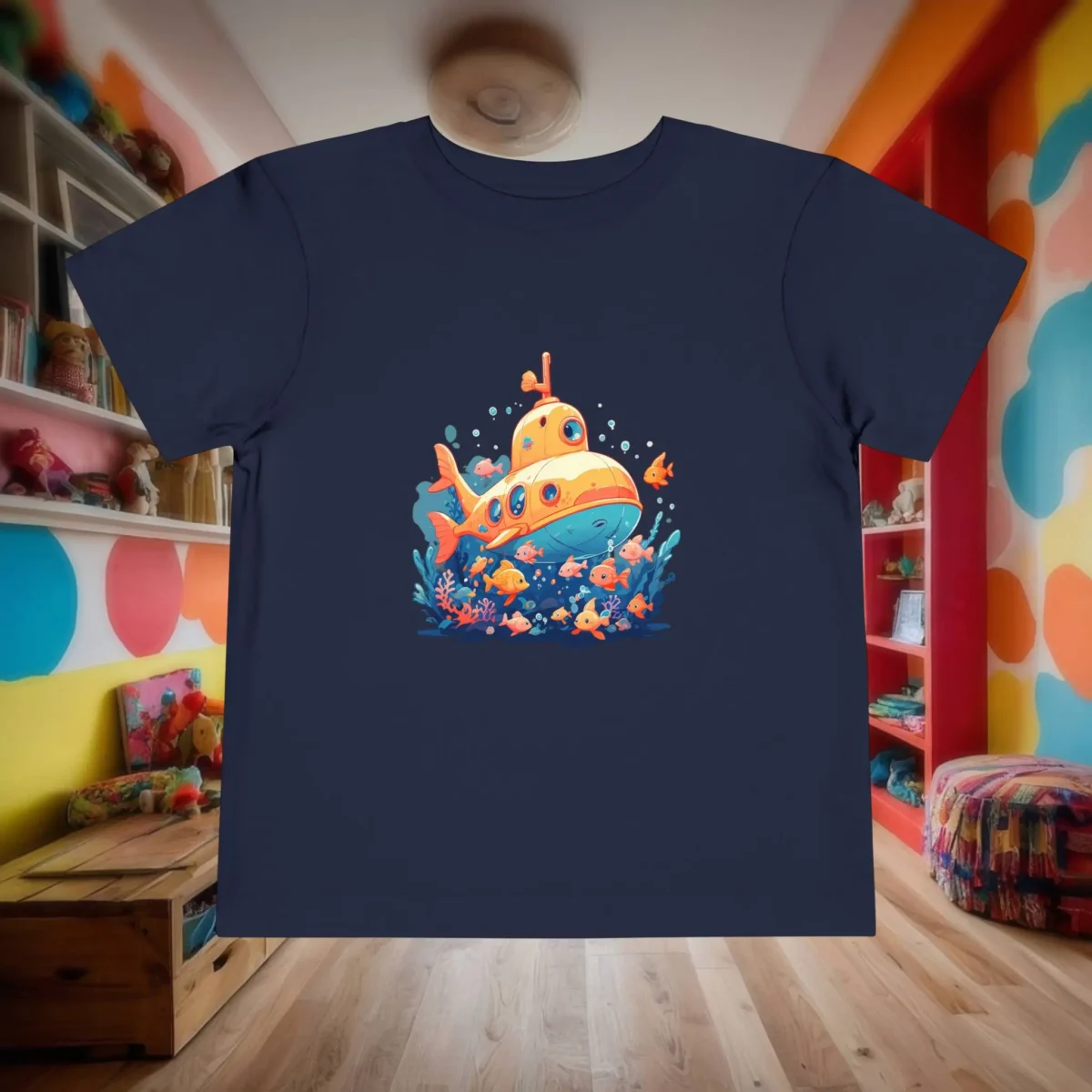 Flat-lay navy toddler t-shirt with bright yellow cartoon submarine and fish