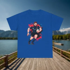 Flatlay of a blue t-shirt with a graphic of a rugby player running with the ball surrounded by colorful splashes.