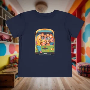 Flat lay of navy toddler t-shirt with cute cartoon kids on a green school bus