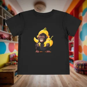 Flat lay of a black toddler t-shirt featuring a smiling baby gorilla surrounded by bananas.