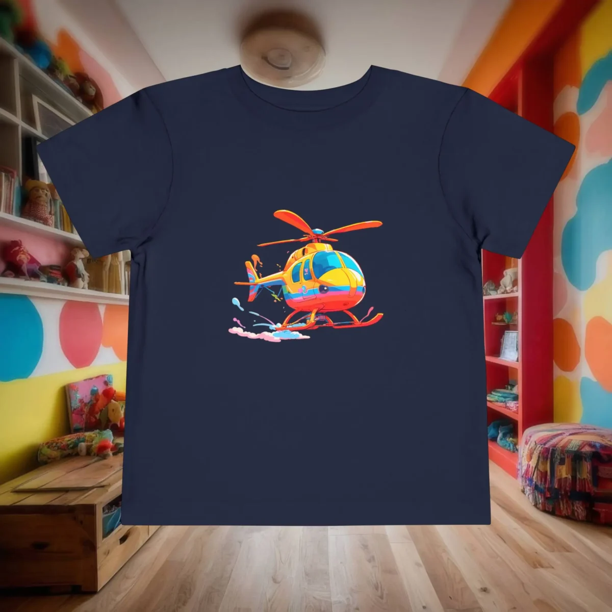 Flat lay of a navy toddler t-shirt with a cartoon-style colorful helicopter in flight.