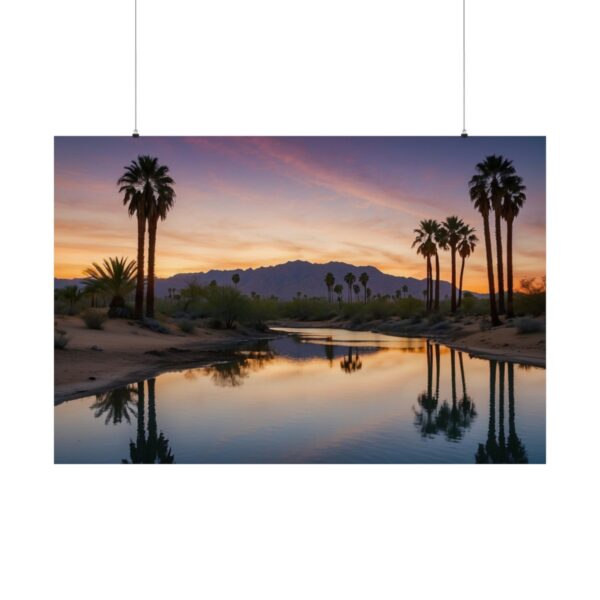 sunset desert scene with palm trees and mountain reflected in a calm stream