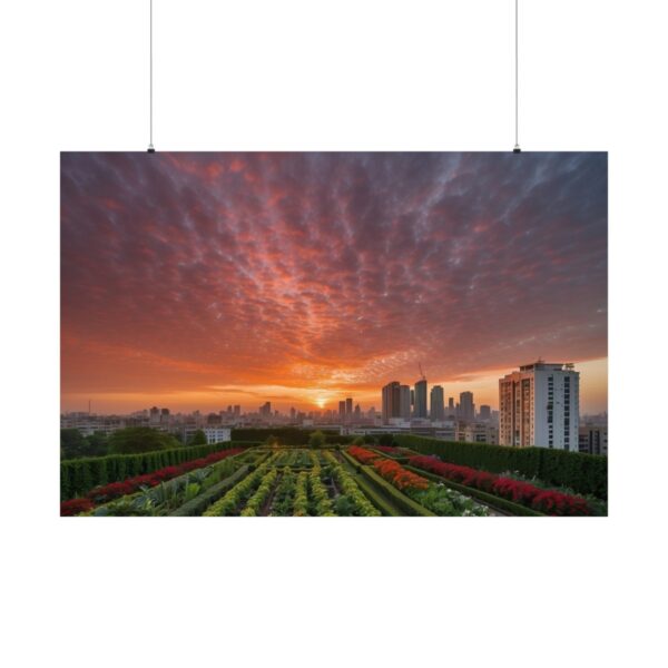 Rooftop garden with vibrant plants overlooking a city skyline at sunset, with dramatic clouds and a glowing sky.