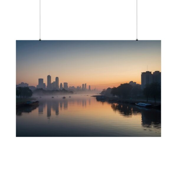 City skyline at sunrise with buildings and trees reflected in a calm river, surrounded by mist and soft orange light.