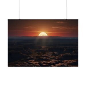 sunset over a vast desert landscape with rugged terrain