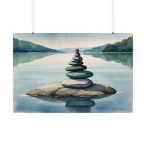 Stack of smooth stones balanced on a rock in calm water, with peaceful reflections of distant hills in the background.