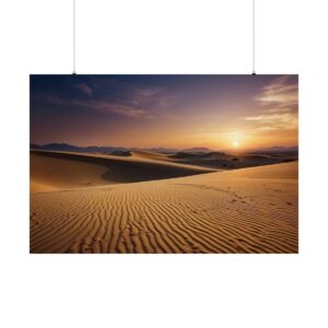 Expansive desert landscape with rippled sand dunes at sunset, casting golden light and long shadows under a colorful sky.