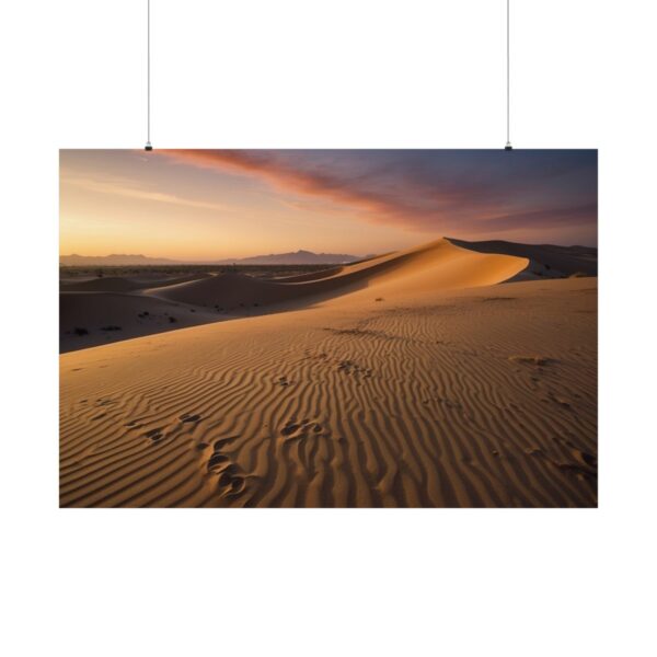 Desert sand dunes with rippled textures at sunset, casting long shadows and a colorful sky with soft clouds in the background.