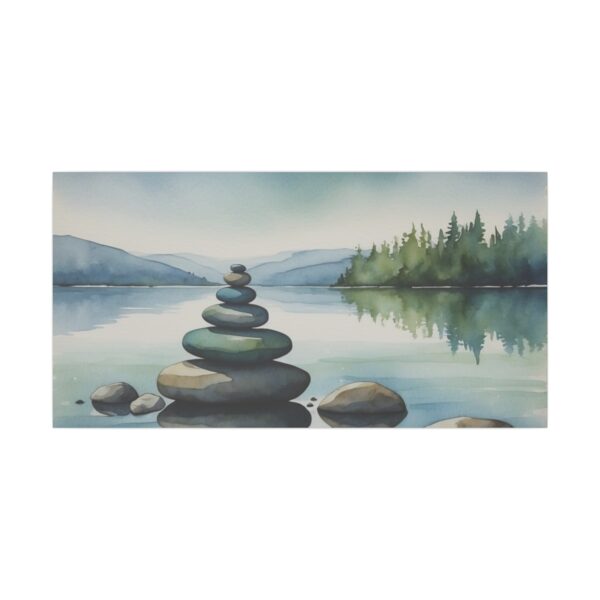 stacked stones by a serene lake with calm water and distant trees