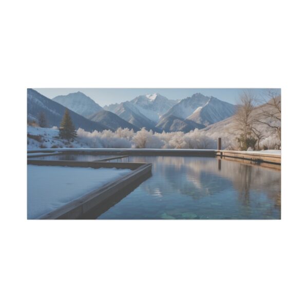 tranquil snowy landscape with mountains reflecting in a calm lake