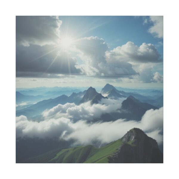 Sunlight shining over mountain peaks surrounded by clouds