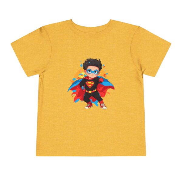 Toddler short sleeve tee with a superhero design on a mustard yellow background