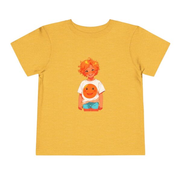 Yellow toddler T-shirt with a smiling boy and an orange illustration