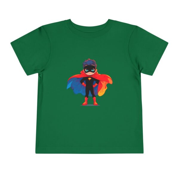 Green toddler short sleeve tee with a cute superhero illustration featuring a child in a colorful cape and mask