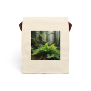 Canvas lunch bag with strap featuring a green fern design in a misty forest setting.