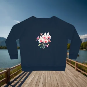 Flat lay of navy sweatshirt with orchid floral design, displayed on a lakeside wooden boardwalk