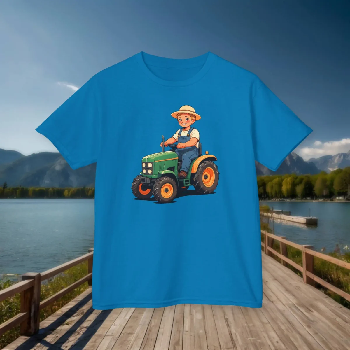 Flat lay of blue kids t-shirt with cartoon tractor and farmer design