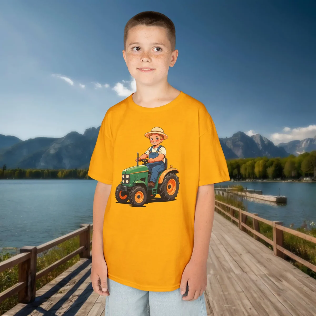Boy in yellow t-shirt with cute cartoon farmer on green tractor