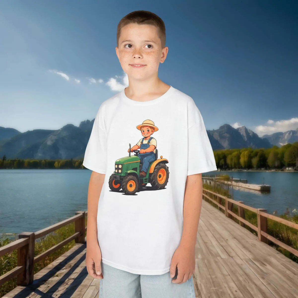 Smiling boy in white t-shirt with colorful cartoon tractor design