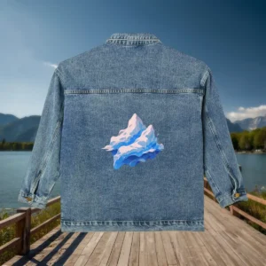 Back view of denim jacket featuring a pastel blue and pink glacier illustration