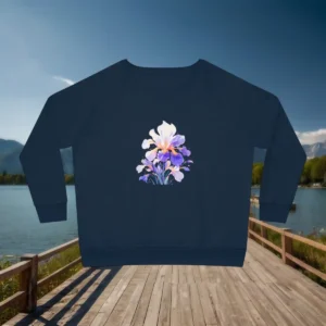 Flat lay of navy women’s relaxed fit sweatshirt with iris flower print, displayed on a boardwalk near a lake