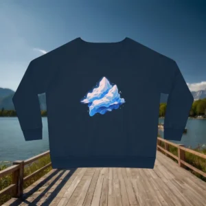 Flat lay of navy relaxed fit sweatshirt with glacier illustration, displayed on wooden walkway by a lake