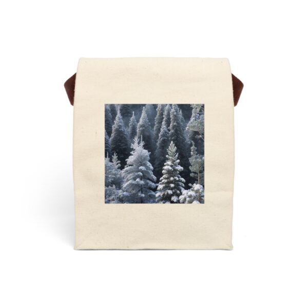 Canvas lunch bag with strap featuring a design of snow-covered evergreen trees in a winter forest