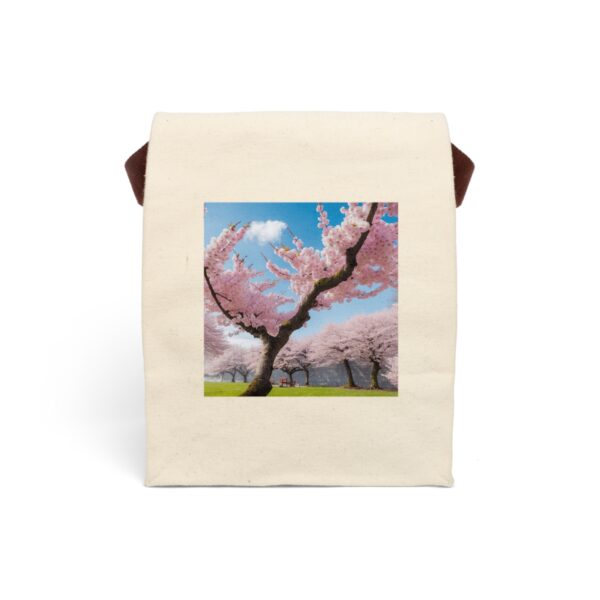 Canvas lunch bag with strap featuring a cherry blossom tree in full bloom with pink flowers against a blue sky