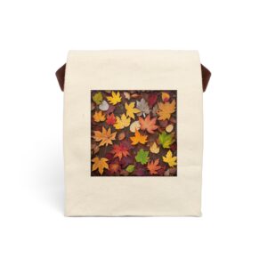 Canvas lunch bag with strap featuring a design of colorful autumn leaves in shades of yellow, orange, red, and brown