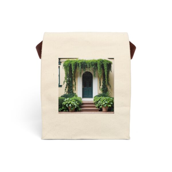 Canvas lunch bag with strap featuring a charming doorway with cascading greenery design