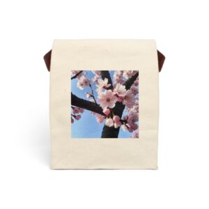 Canvas lunch bag with strap featuring a cherry blossom tree with pink flowers against a blue sky