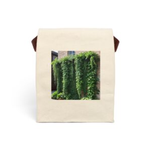 Canvas lunch bag with strap featuring a lush green ivy cascading down a brick wall design