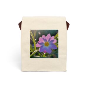 Canvas lunch bag with strap featuring a close-up of a single pink flower design