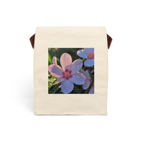 Canvas lunch bag with strap featuring a close-up of dewy pink flowers design