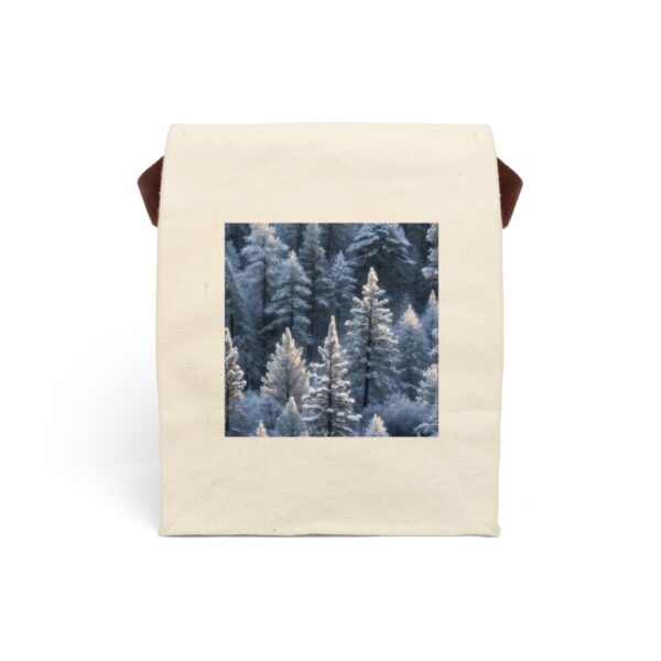 Canvas lunch bag with strap featuring a design of snow-covered trees in a peaceful winter forest