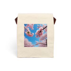 Canvas lunch bag with strap featuring cherry blossom branches with pink flowers against a bright blue sky