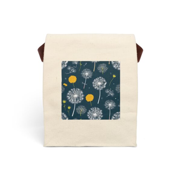 Canvas lunch bag with strap featuring a dandelion seed pattern with yellow accents on a dark background