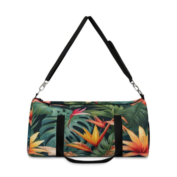 Duffel bag with bold tropical floral pattern and adjustable shoulder strap