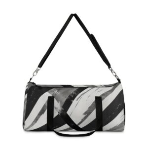 Duffel bag with bold black and white brushstroke diagonal stripes and adjustable shoulder strap