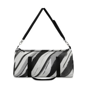 Duffel bag with wide black and gray diagonal stripes and adjustable shoulder strap